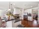 Open kitchen with breakfast bar, stainless steel appliances, and hardwood floors at 4854 Cathedral Ct, Powder Springs, GA 30127