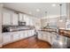 Modern kitchen with white cabinets, stainless steel appliances, and granite countertops at 4854 Cathedral Ct, Powder Springs, GA 30127