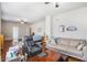 Spacious living area open to the main bedroom, with hardwood floors and comfortable seating at 4854 Cathedral Ct, Powder Springs, GA 30127