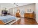 Large main bedroom with hardwood flooring, and multiple windows providing ample natural light at 4854 Cathedral Ct, Powder Springs, GA 30127