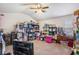 Spacious bonus room featuring vaulted ceilings, a ceiling fan, and lots of storage at 4854 Cathedral Ct, Powder Springs, GA 30127