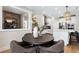 Bright dining area with seating for four adjacent to a modern kitchen with stainless steel appliances and white cabinetry at 5430 Hyde Rd, Cumming, GA 30040
