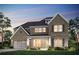 Charming two-story brick home featuring a manicured lawn, covered porch, and attached two-car garage at 5430 Hyde Rd, Cumming, GA 30040