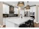 Spacious kitchen with a large island, stainless steel appliances, and pendant lighting at 5430 Hyde Rd, Cumming, GA 30040