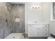 Modern bathroom with a tiled walk-in shower and sleek white vanity, offering a spa-like experience at 860 Crest Valley Dr, Sandy Springs, GA 30327