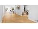 Bright foyer with beautiful wood floors and a glimpse into the open, airy living areas at 860 Crest Valley Dr, Sandy Springs, GA 30327