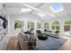 Spacious living room featuring high ceilings, skylights, and an abundance of natural light at 860 Crest Valley Dr, Sandy Springs, GA 30327