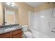 Bathroom featuring a single sink vanity with granite countertop and a tub/shower combo at 125 Ancient Oak Ln, Stockbridge, GA 30281