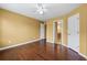 Spacious bedroom featuring hardwood floors with doors to the hallway and ensuite at 125 Ancient Oak Ln, Stockbridge, GA 30281