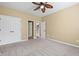 Neutral bedroom featuring a closet with doors and gray carpet at 125 Ancient Oak Ln, Stockbridge, GA 30281