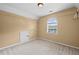 Spacious walk-in closet with carpet, adjustable shelving and a window for natural light at 125 Ancient Oak Ln, Stockbridge, GA 30281