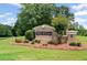 Moffett Crossing community entrance sign with brick accents and landscaped greenery at 125 Ancient Oak Ln, Stockbridge, GA 30281