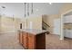 Open floor plan featuring a kitchen island with bar seating and stainless steel appliances at 125 Ancient Oak Ln, Stockbridge, GA 30281