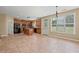 Open-concept kitchen featuring a center island, pendant lighting, and ample natural light at 125 Ancient Oak Ln, Stockbridge, GA 30281