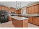 Charming kitchen with stainless steel appliances, custom cabinets, and central island at 125 Ancient Oak Ln, Stockbridge, GA 30281