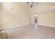 Open living area featuring tile flooring, neutral walls, and bright natural light at 125 Ancient Oak Ln, Stockbridge, GA 30281