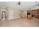 Bright living area with an open concept, featuring a kitchen island and bar seating at 125 Ancient Oak Ln, Stockbridge, GA 30281