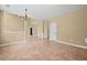 Inviting living room with tile floors, neutral paint, and plenty of natural light at 125 Ancient Oak Ln, Stockbridge, GA 30281