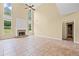Spacious living room featuring a fireplace, tile floors, and large windows at 125 Ancient Oak Ln, Stockbridge, GA 30281
