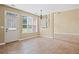 Living room with an open floor plan, tile floors, and a door leading to the backyard at 125 Ancient Oak Ln, Stockbridge, GA 30281
