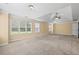 Spacious main bedroom featuring a tray ceiling, and windows with blinds at 125 Ancient Oak Ln, Stockbridge, GA 30281