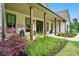 Charming front porch with craftsman columns and lush landscaping at 131 Forsyth Park Ln, Woodstock, GA 30188