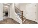 Hallway featuring hardwood floors leading to a laundry room at 131 Forsyth Park Ln, Woodstock, GA 30188