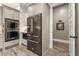 Kitchen featuring stainless steel appliances and gray cabinets, combining style and functionality for culinary enthusiasts at 131 Forsyth Park Ln, Woodstock, GA 30188
