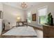 Well-lit home office featuring hardwood floors, natural light and stylish furnishings at 131 Forsyth Park Ln, Woodstock, GA 30188