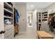 Spacious walk-in closet with custom shelving and ample storage; organizational dream at 131 Forsyth Park Ln, Woodstock, GA 30188