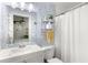 Bathroom featuring a white vanity, toilet and shower with blue patterned accent wall at 1744 Blossom Ln, Austell, GA 30168