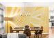 Dining area with stylish wall art, modern lighting, and seating for four, open to the kitchen at 1744 Blossom Ln, Austell, GA 30168