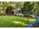 Beautiful home with lush front yard, blue hydrangeas, and a cozy screened-in porch at 1744 Blossom Ln, Austell, GA 30168