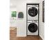 A modern, stacked washer and dryer unit neatly tucked away in the laundry closet space at 1744 Blossom Ln, Austell, GA 30168