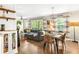 Open-concept living space with hardwood floors, stylish furniture, and lots of natural light at 1744 Blossom Ln, Austell, GA 30168