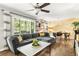 Comfortable living room with large sectional sofa, decorative wall, and bright natural light at 1744 Blossom Ln, Austell, GA 30168