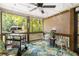 Relaxing screened-in porch featuring a pizza oven, comfortable seating, and views of the backyard at 1744 Blossom Ln, Austell, GA 30168