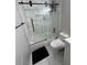 Contemporary bathroom with marble tile, glass shower door, and sleek fixtures at 2535 Village Creek Lndg, Atlanta, GA 30316