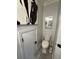 Small bathroom featuring a toilet and decorative vanity with a creative piece of artwork on the wall at 2535 Village Creek Lndg, Atlanta, GA 30316