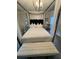 Bedroom featuring a four-poster bed with mirrored nightstands at 2535 Village Creek Lndg, Atlanta, GA 30316