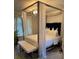 Bedroom featuring a four-poster bed with a white bench at 2535 Village Creek Lndg, Atlanta, GA 30316