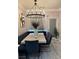 Bright dining room features a modern chandelier, seating bench, and sleek table with stylish chairs at 2535 Village Creek Lndg, Atlanta, GA 30316