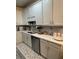 Bright kitchen featuring white cabinets, stainless steel appliances, and sleek countertops at 2535 Village Creek Lndg, Atlanta, GA 30316