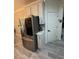 Modern kitchen features stainless steel appliances, white cabinets, and a full size stainless steel refrigerator at 2535 Village Creek Lndg, Atlanta, GA 30316