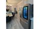Stainless steel LG refrigerator with a glass door sits near the dining area and door at 2535 Village Creek Lndg, Atlanta, GA 30316