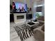 Cozy living room with fireplace, a modern zebra rug, and plush sofa at 2535 Village Creek Lndg, Atlanta, GA 30316