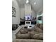 Bright living room with a stone fireplace, television, zebra rug, and modern furniture at 2535 Village Creek Lndg, Atlanta, GA 30316