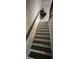 Stairway featuring dark wood treads and patterned wallpaper at 2535 Village Creek Lndg, Atlanta, GA 30316