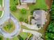 Aerial view of a beautiful home with a well-manicured lawn and mature trees in a desirable neighborhood at 2579 Lulworth Ln, Marietta, GA 30062