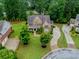 Stunning aerial view of the property with well-manicured lawns and mature trees at 2579 Lulworth Ln, Marietta, GA 30062